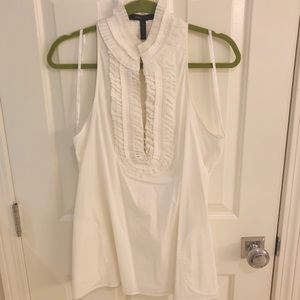 BCBG white sleeveless ruffle top with pockets